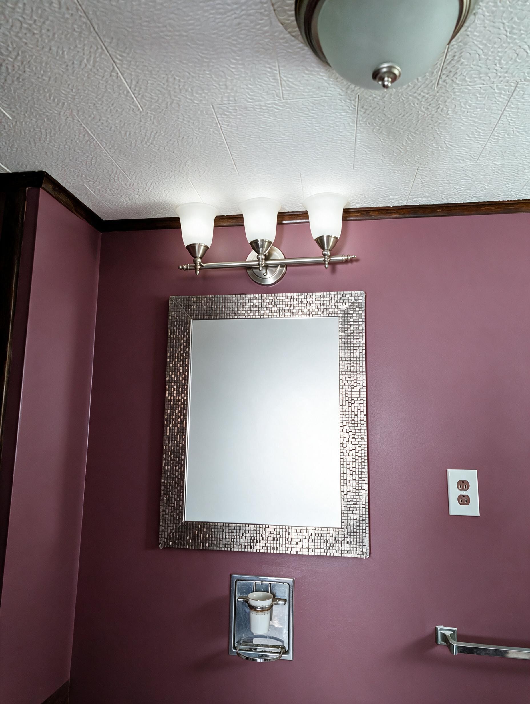 Bathroom vanity mirror with three-bulb light fixture