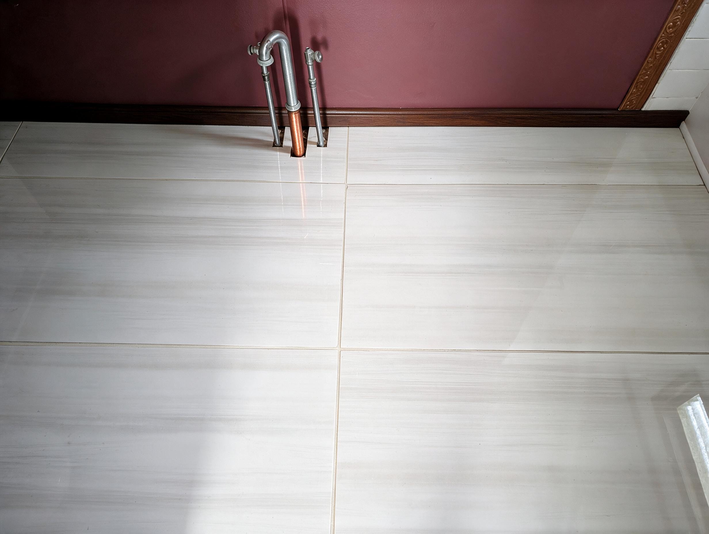 Bathroom floor with polished marble tile